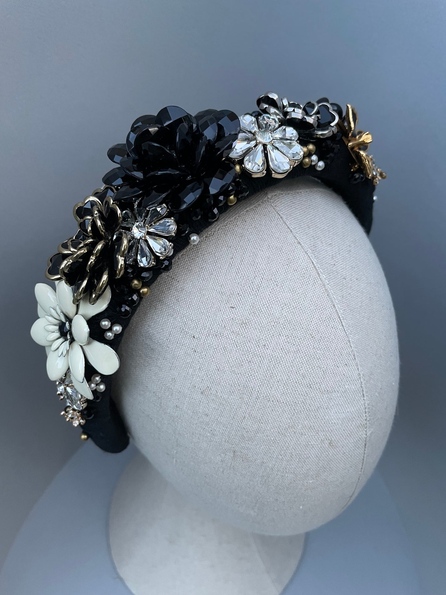 Elaborate brooch encrusted black and white large padded headband