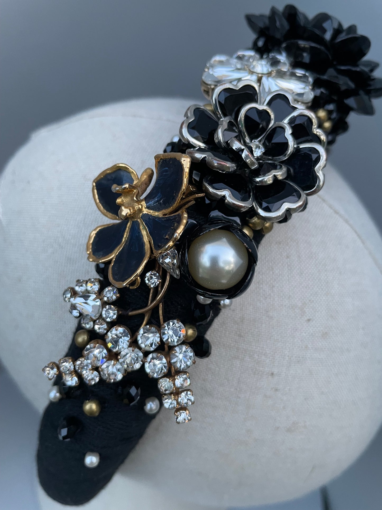Elaborate brooch encrusted black and white large padded headband