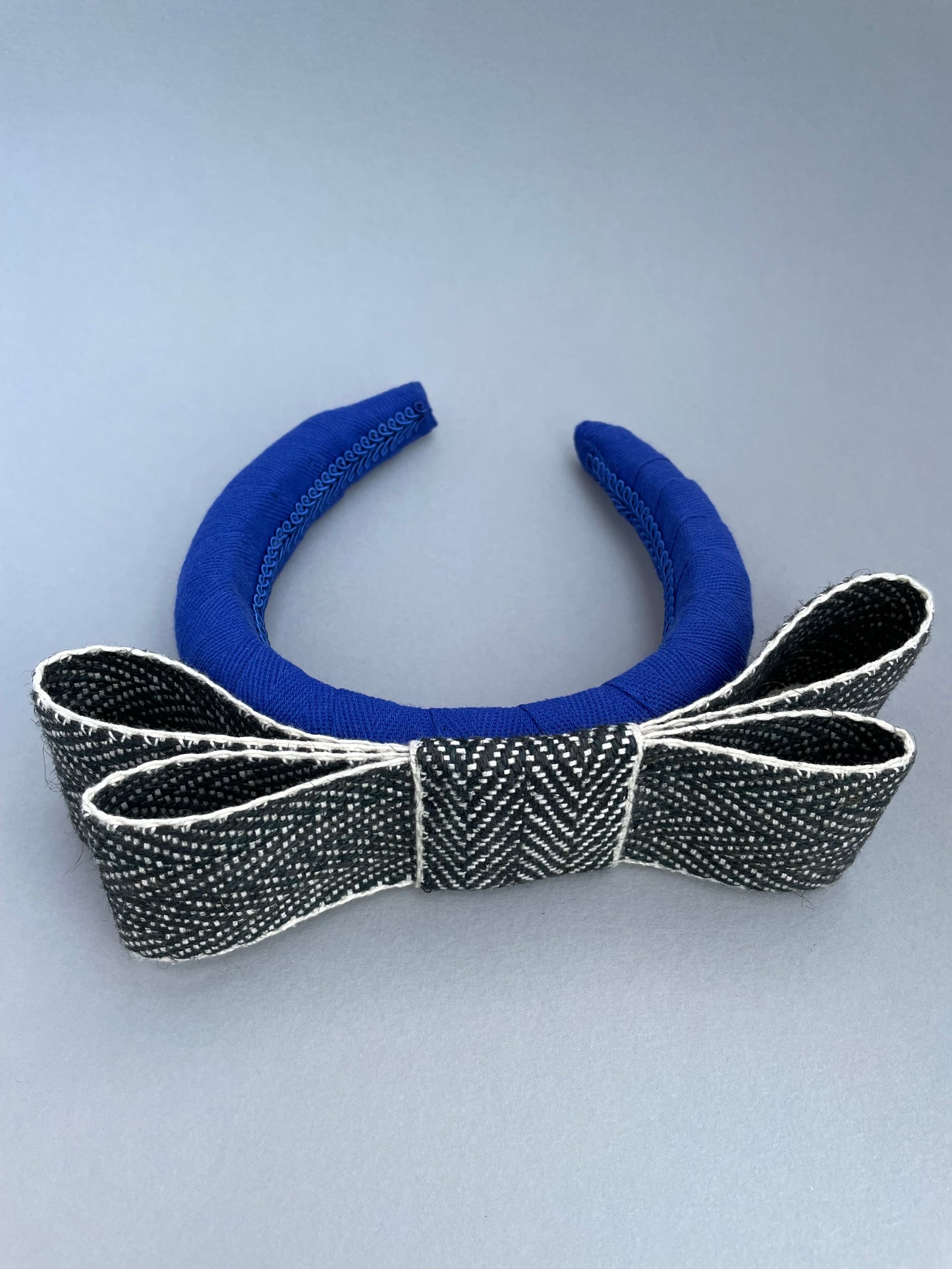 Cobalt blue large padded headband with black and white herringbone braid bow