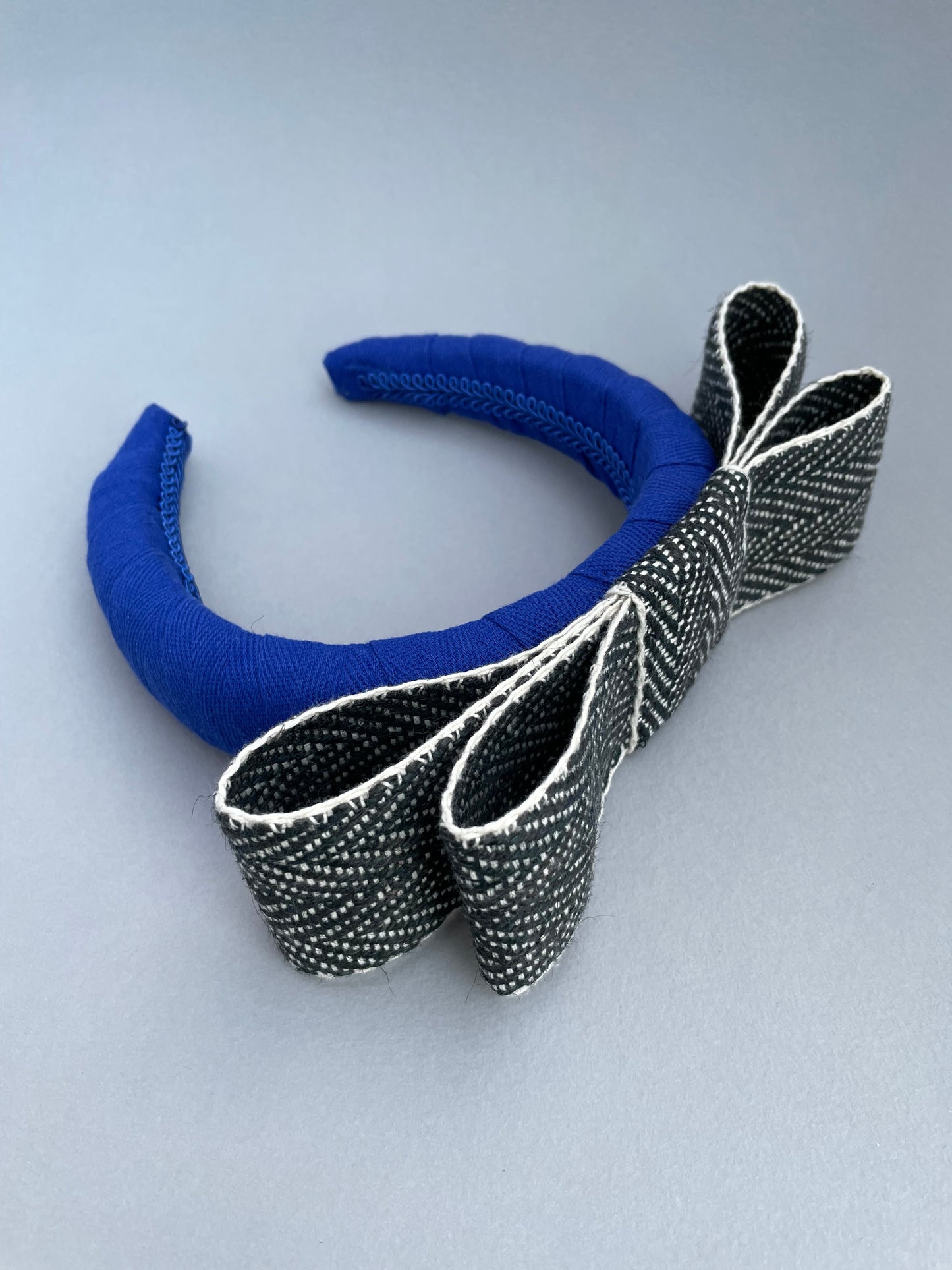 Cobalt blue large padded headband with black and white herringbone braid bow