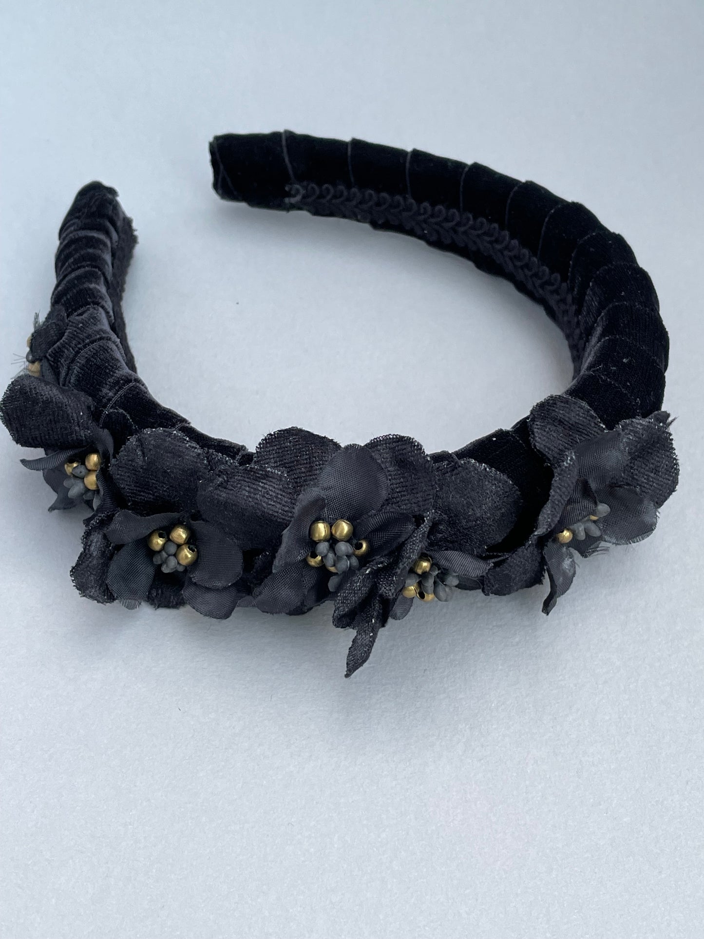 Black velvet padded headband with black velvet and silk flowers