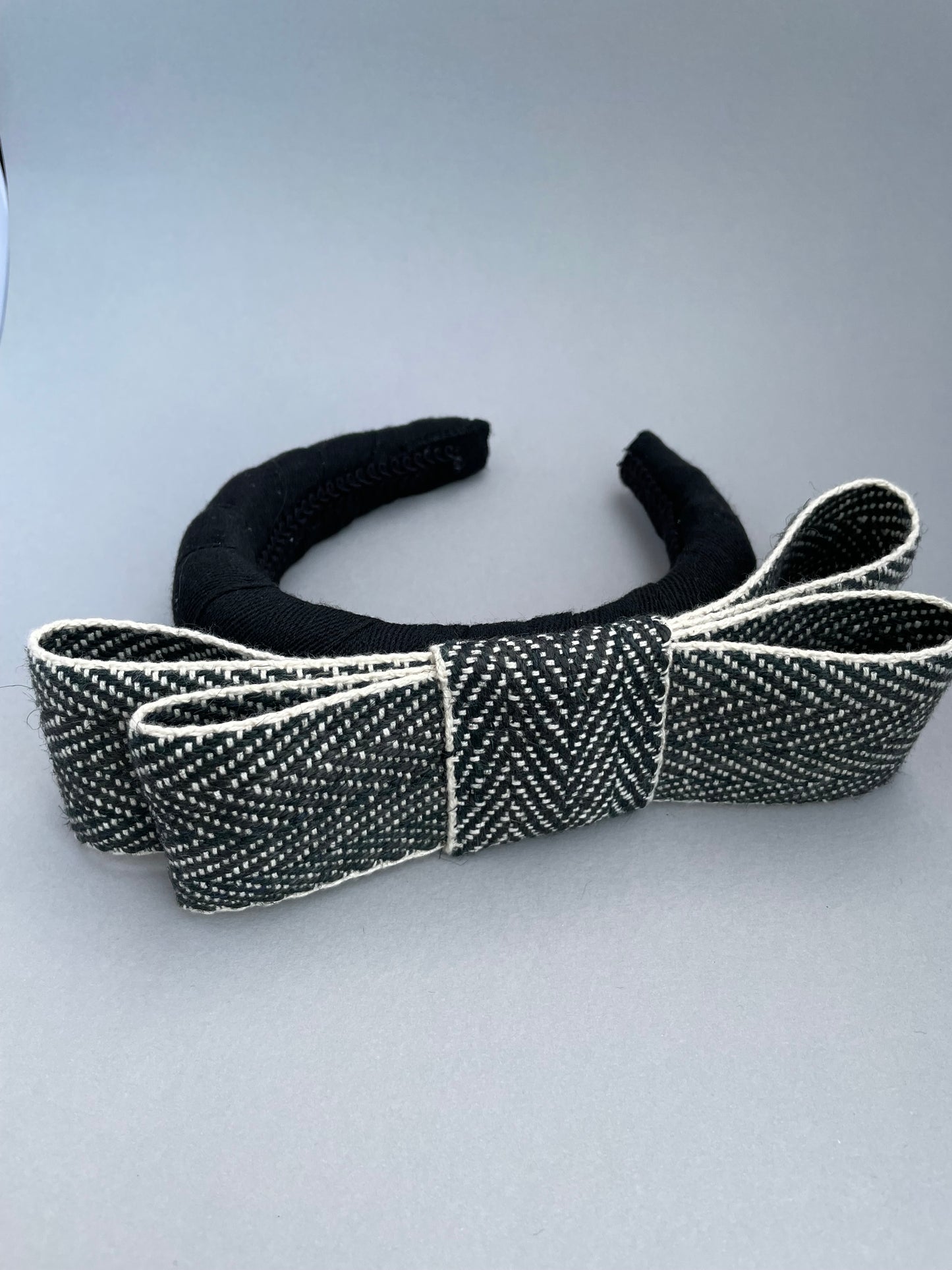 Black large padded headband with black and white herringbone braid bow