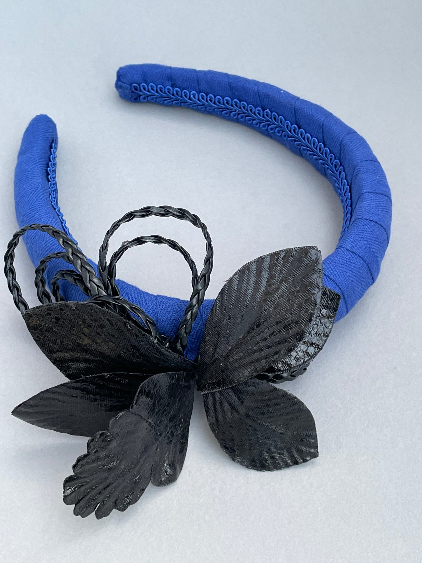 Cobalt blue padded headband with black leatherette orchid