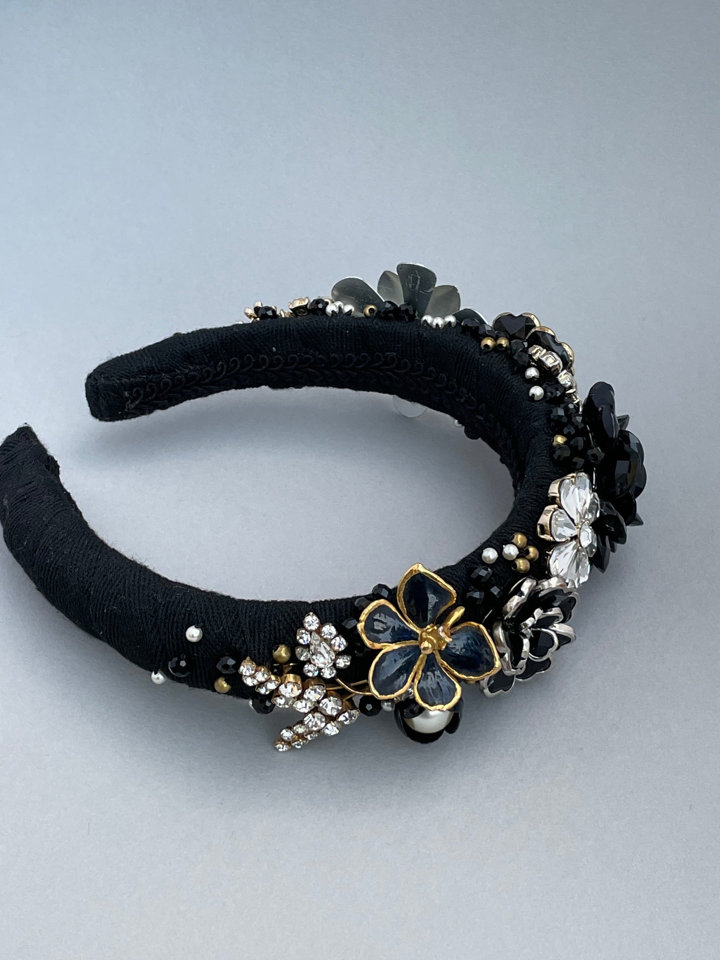 Elaborate brooch encrusted black and white large padded headband