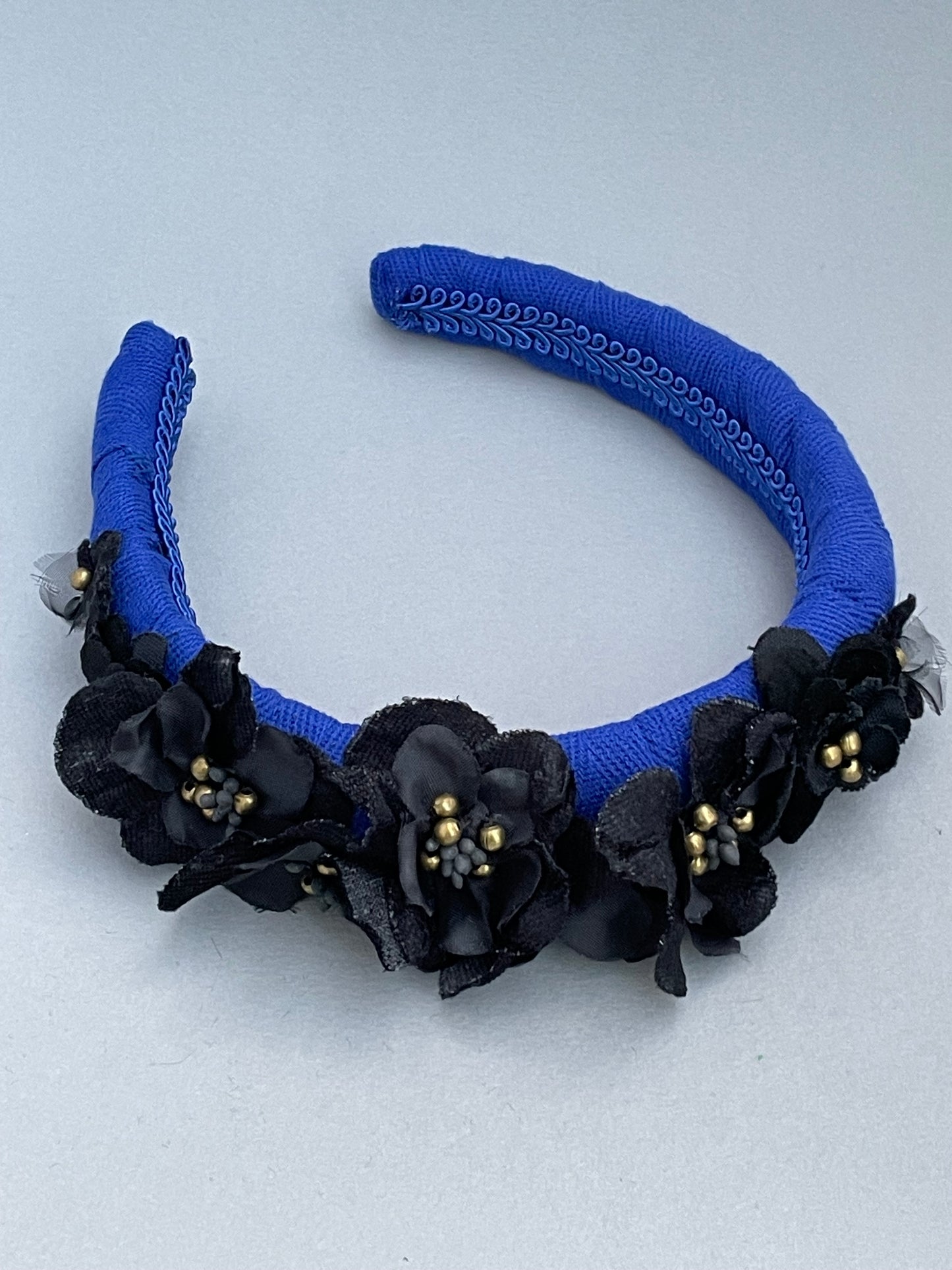 Cobalt blue herringbone padded headband with black velvet and silk flowers