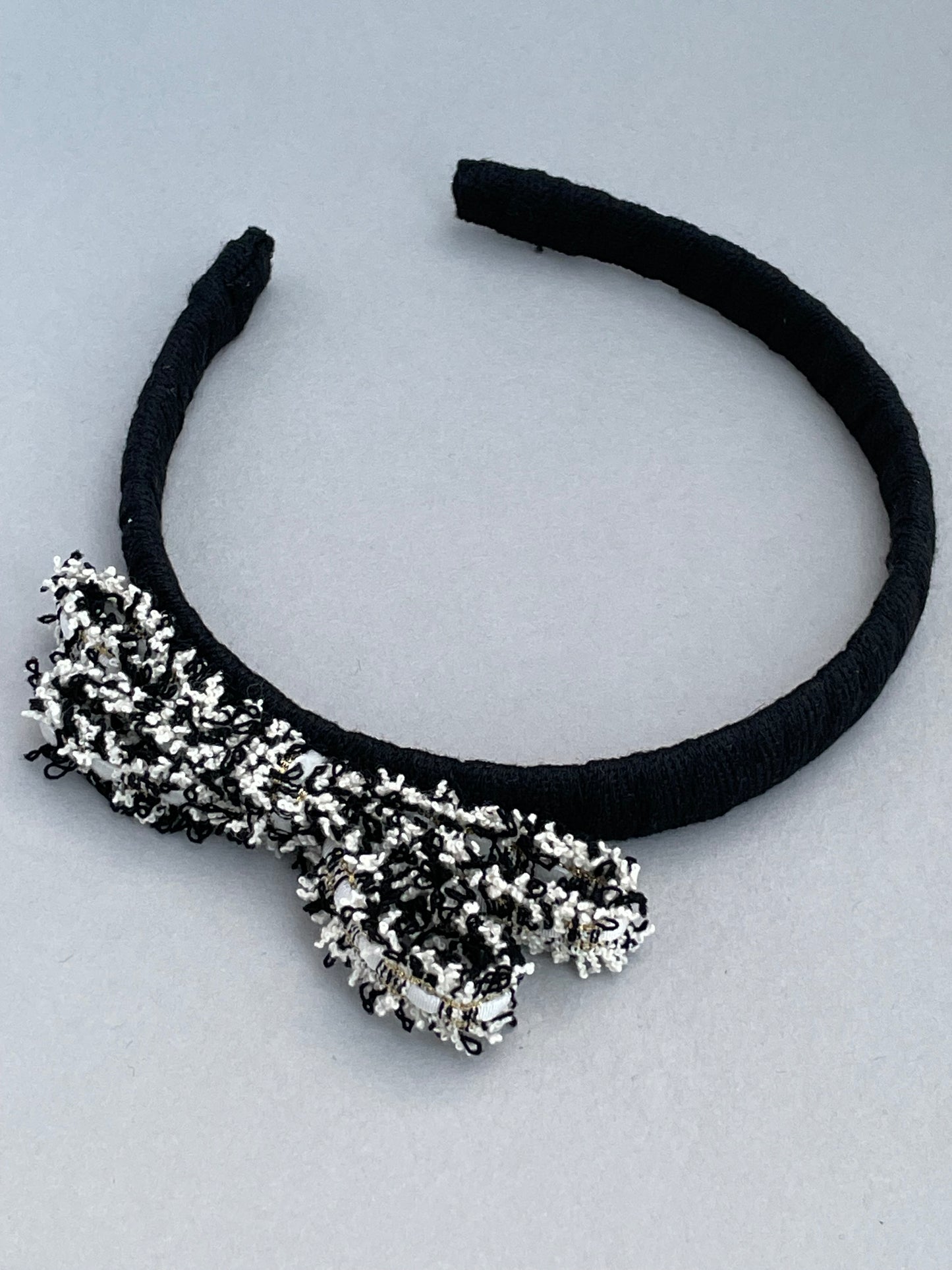 Black slim headband with black and white frayed edge bow