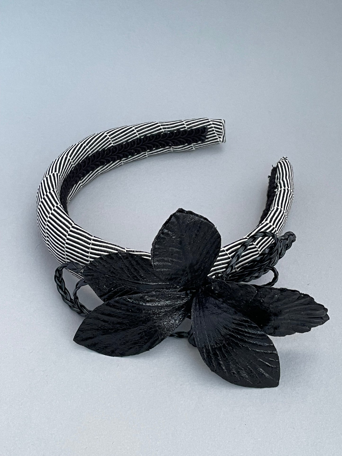 Black and white stripe padded headband with black leatherette orchid