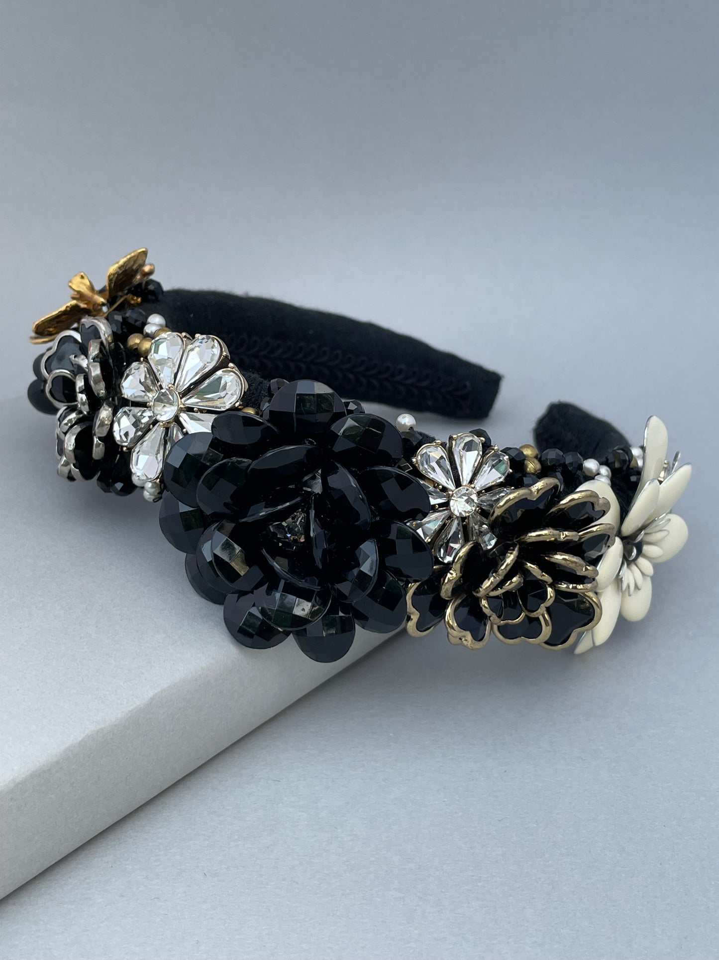 Elaborate brooch encrusted black and white large padded headband