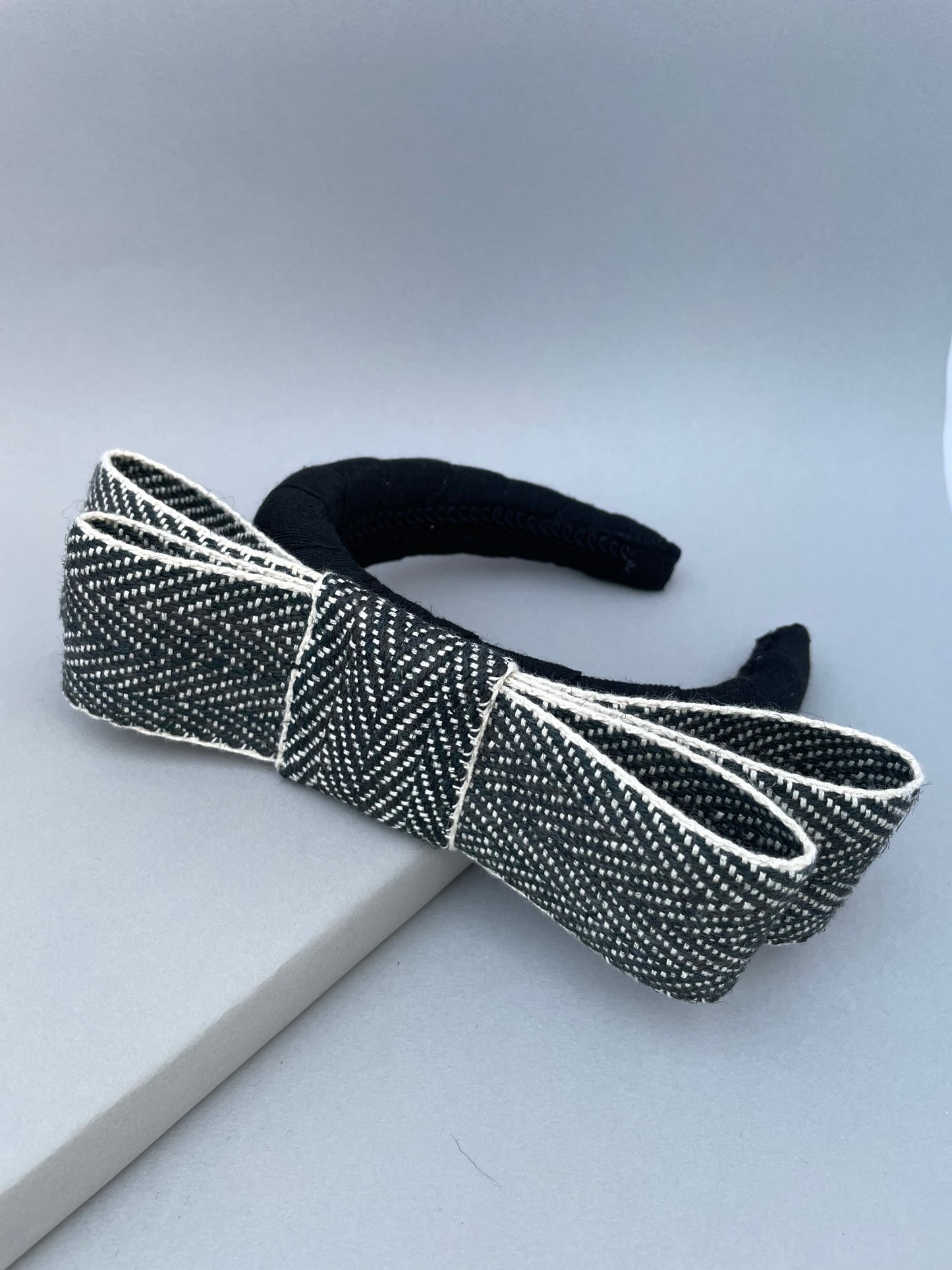 Black large padded headband with black and white herringbone braid bow