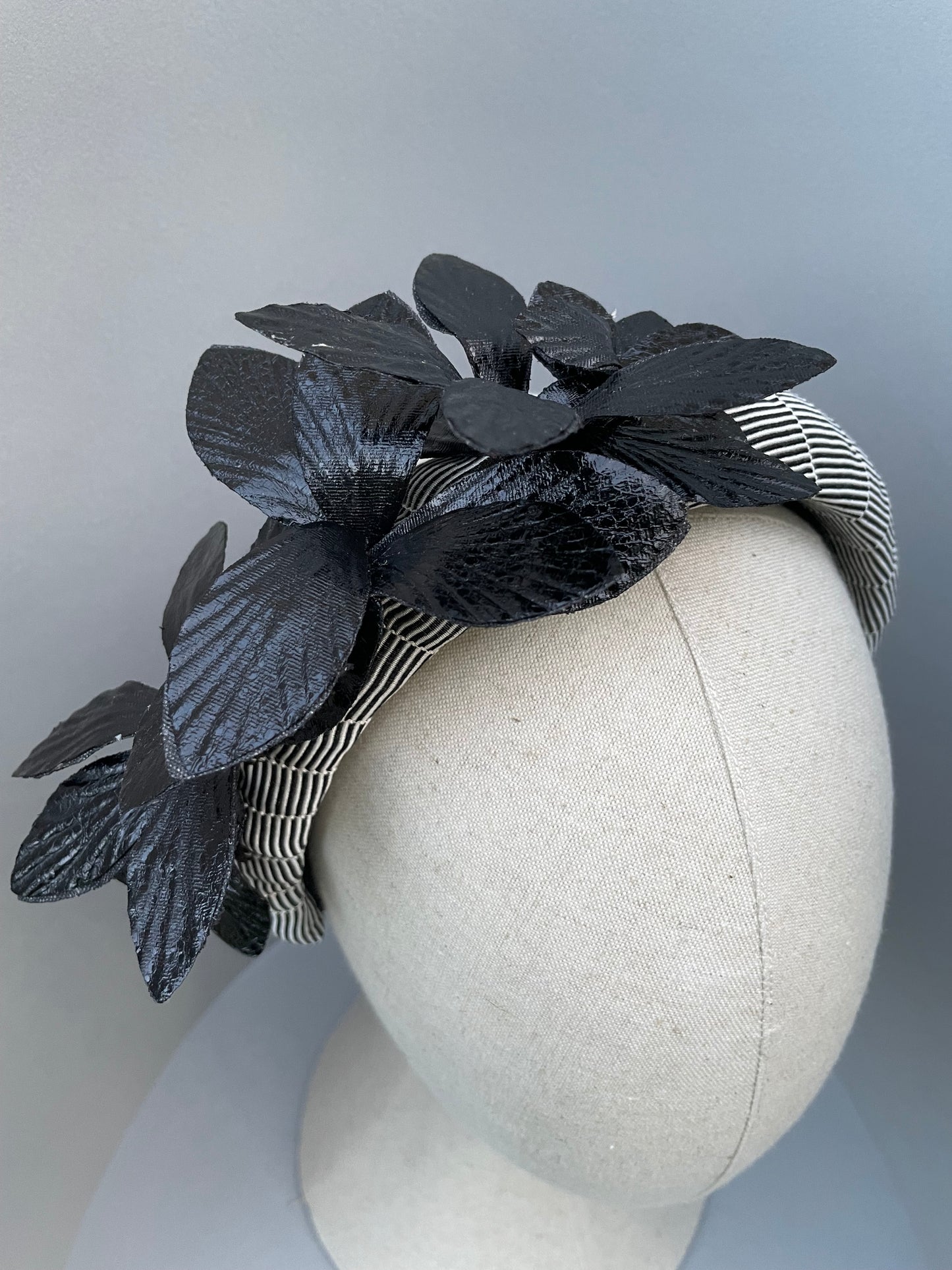 Black and white stripe statement padded headband with black leatherette orchid spray