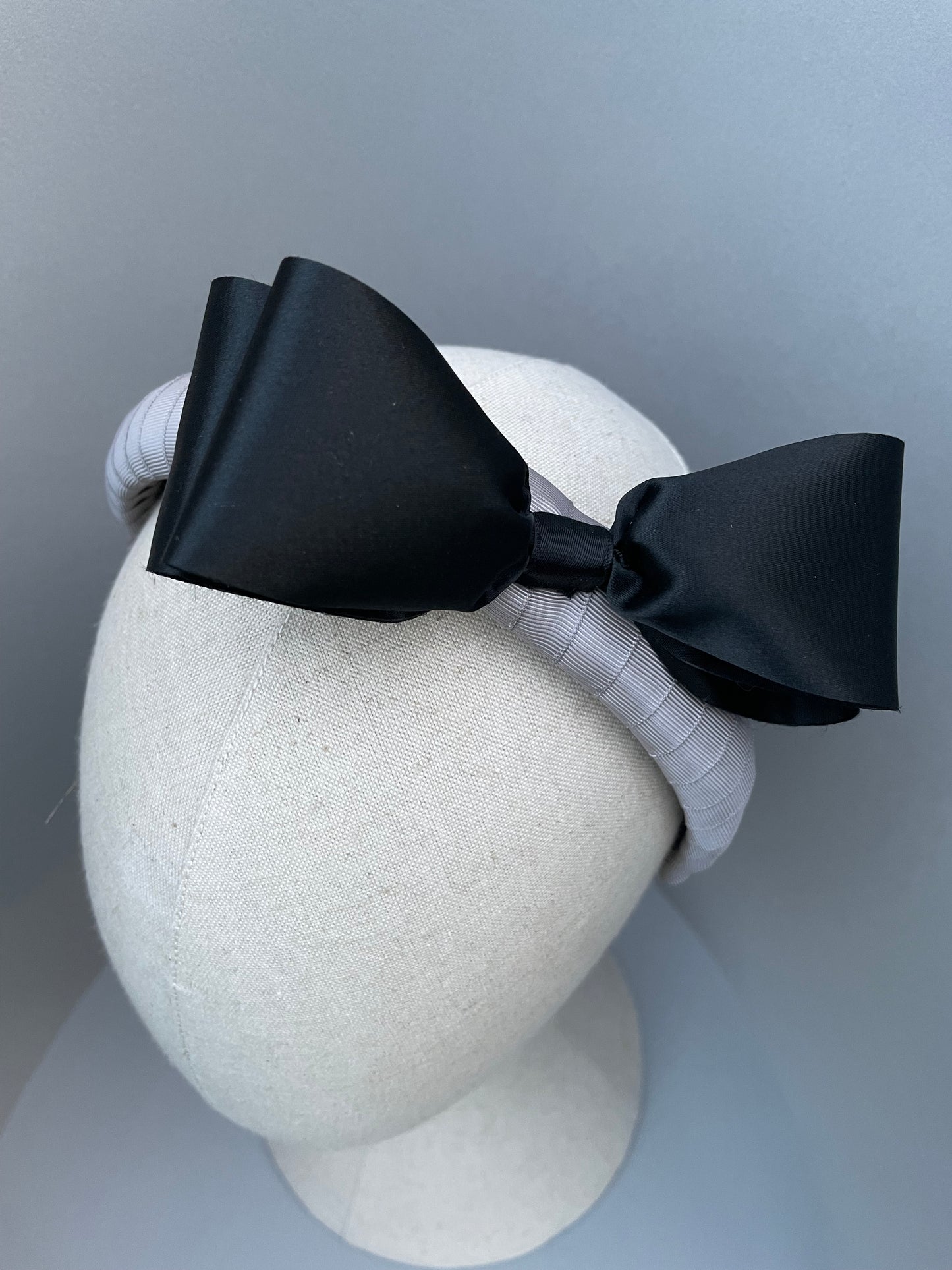 Silver grey padded headband with 1980s black satin vintage bow