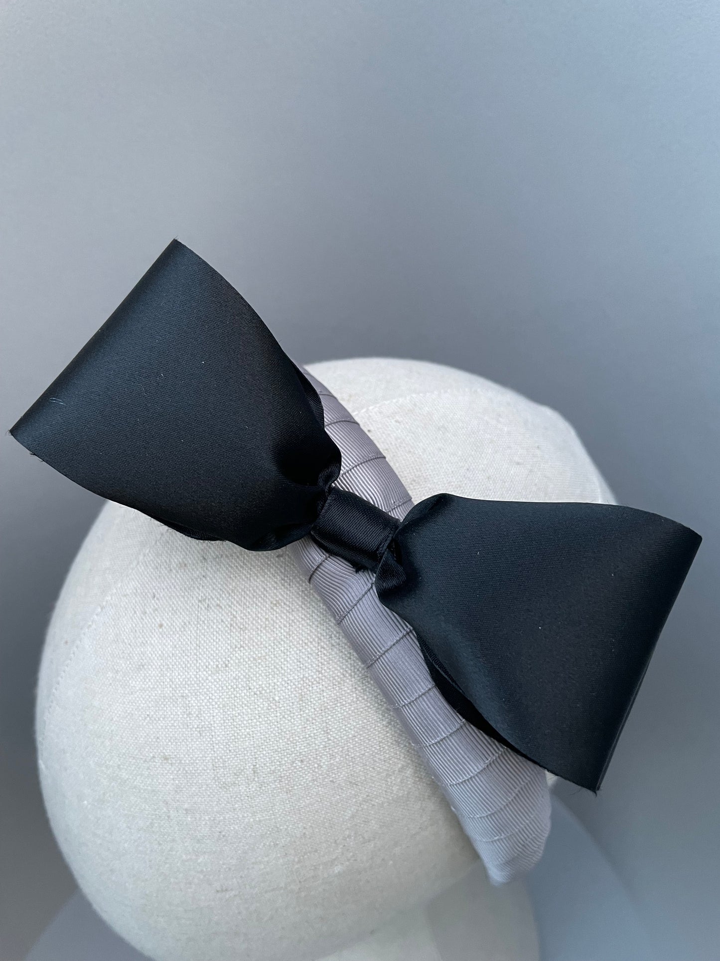 Silver grey padded headband with 1980s black satin vintage bow