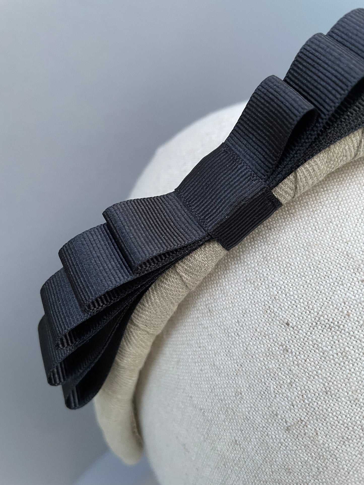 Natural padded headband with black grosgrain ribbon bow