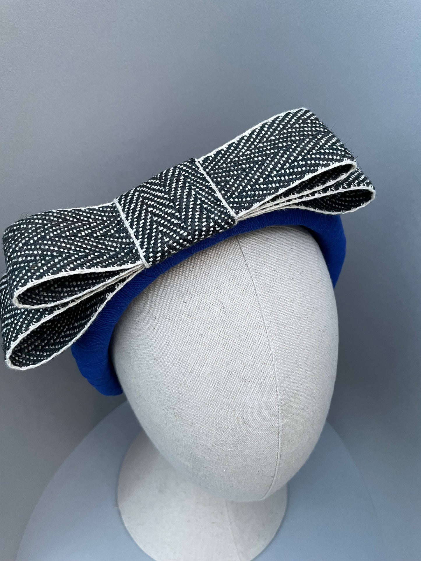 Cobalt blue large padded headband with black and white herringbone braid bow