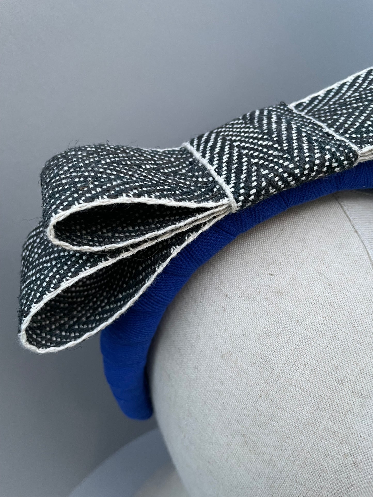 Cobalt blue large padded headband with black and white herringbone braid bow