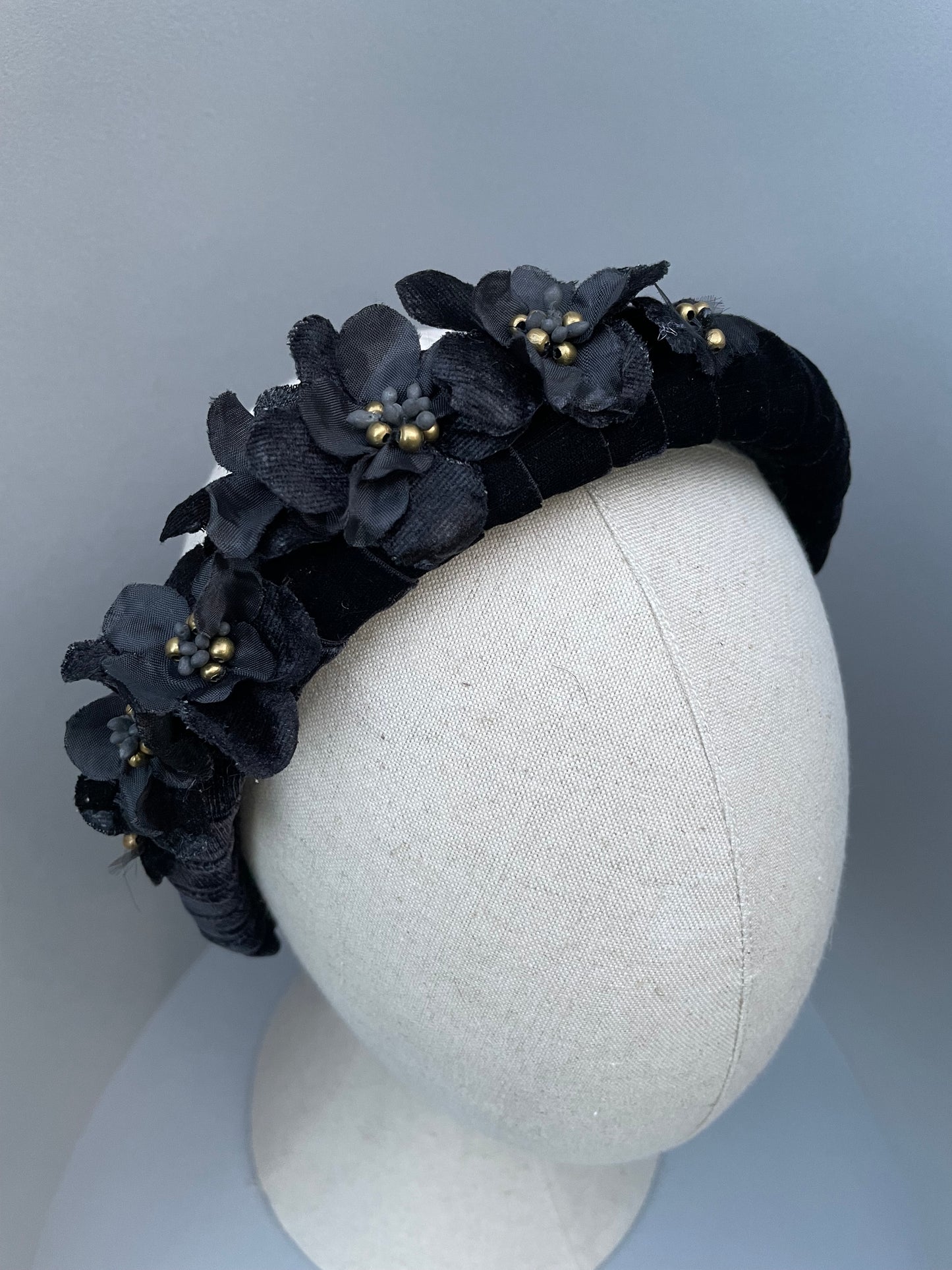 Black velvet padded headband with black velvet and silk flowers