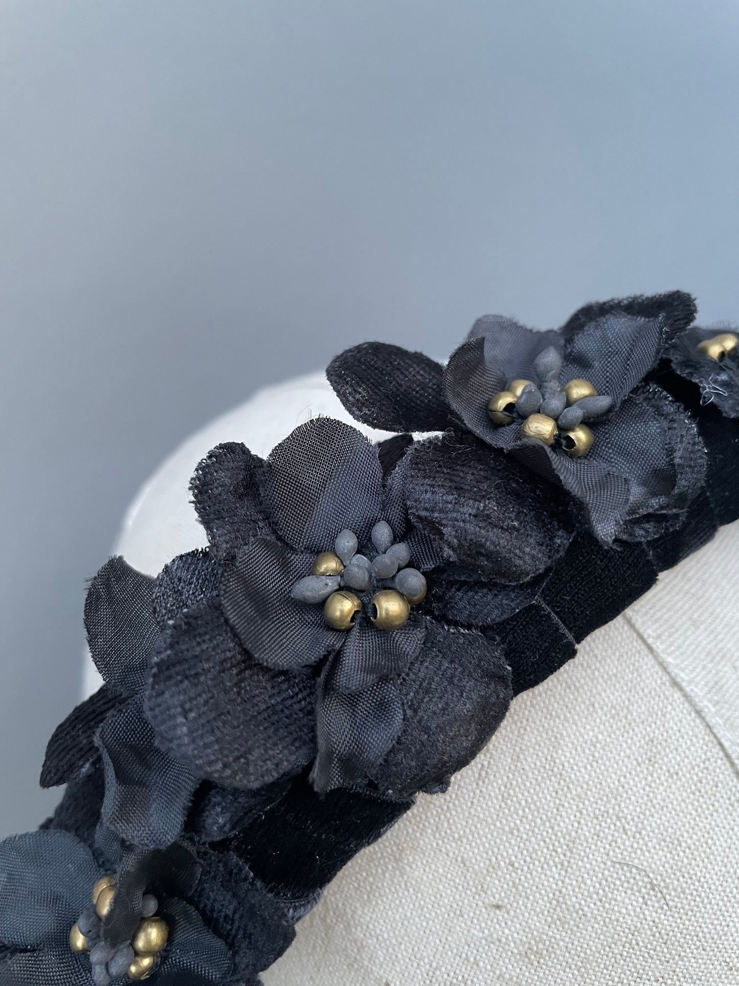 Black velvet padded headband with black velvet and silk flowers