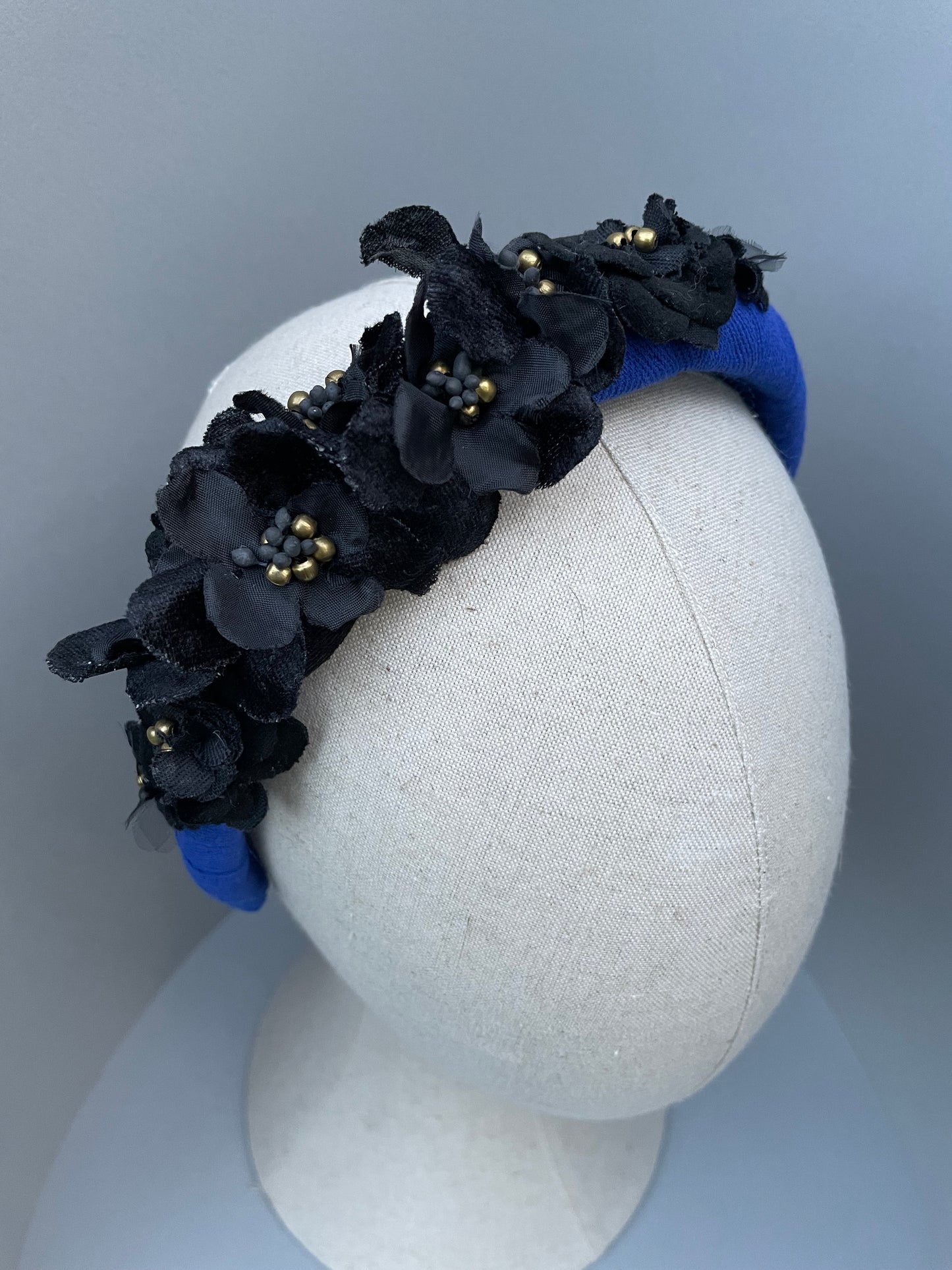 Cobalt blue herringbone padded headband with black velvet and silk flowers