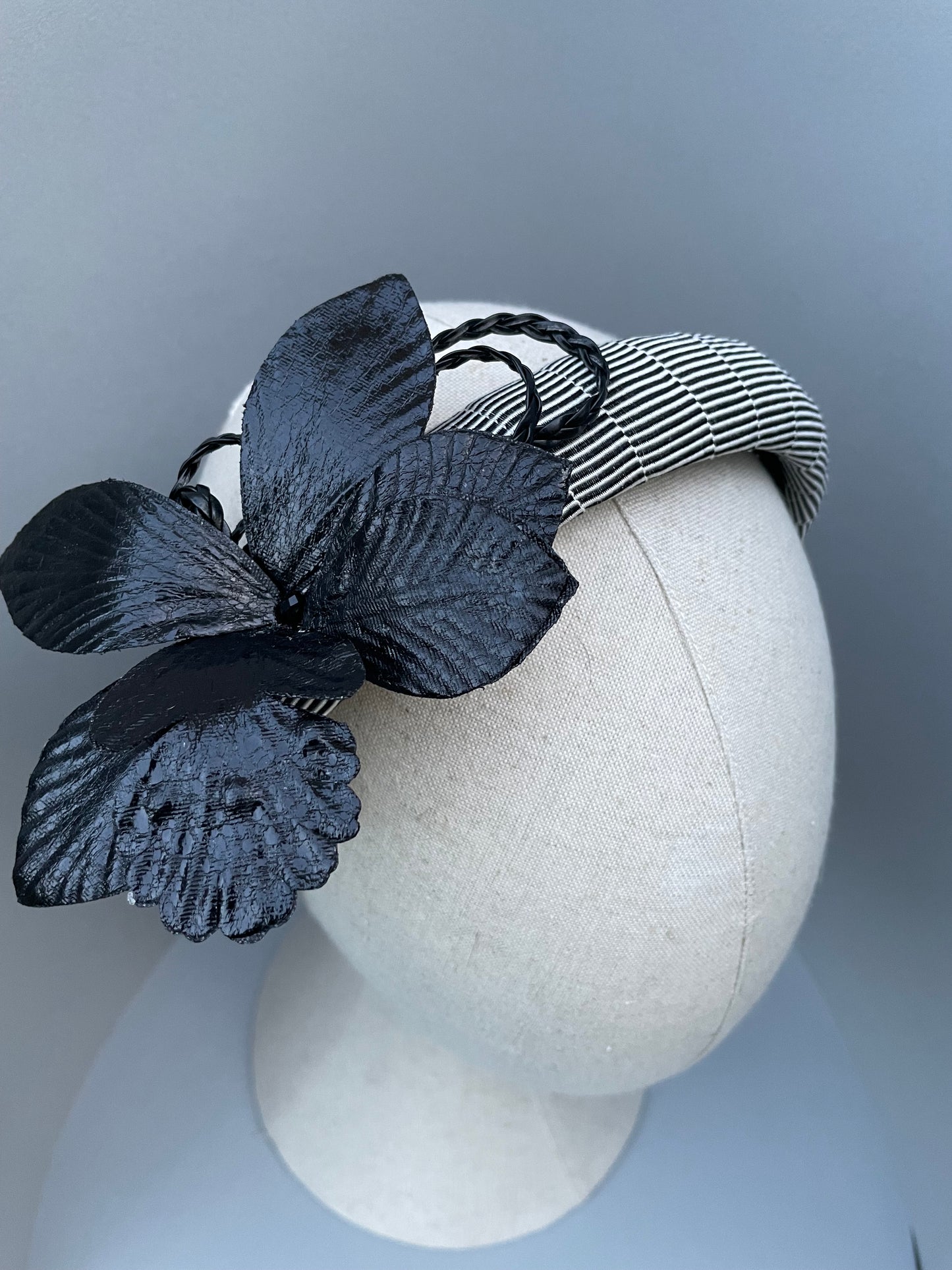 Black and white stripe padded headband with black leatherette orchid