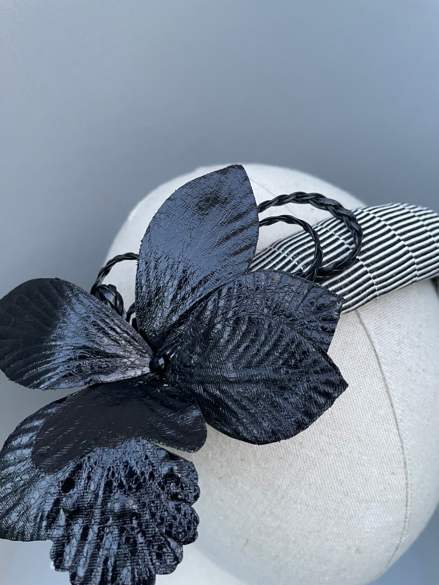 Black and white stripe padded headband with black leatherette orchid