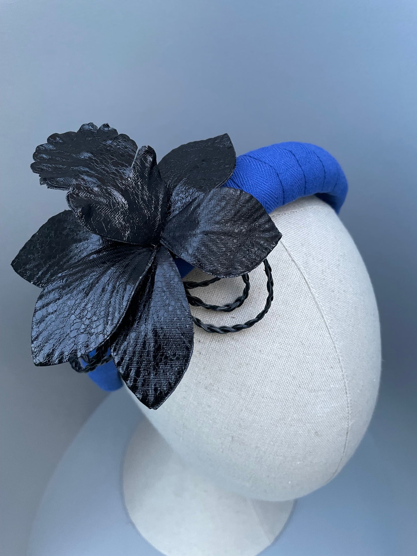 Cobalt blue padded headband with black leatherette orchid