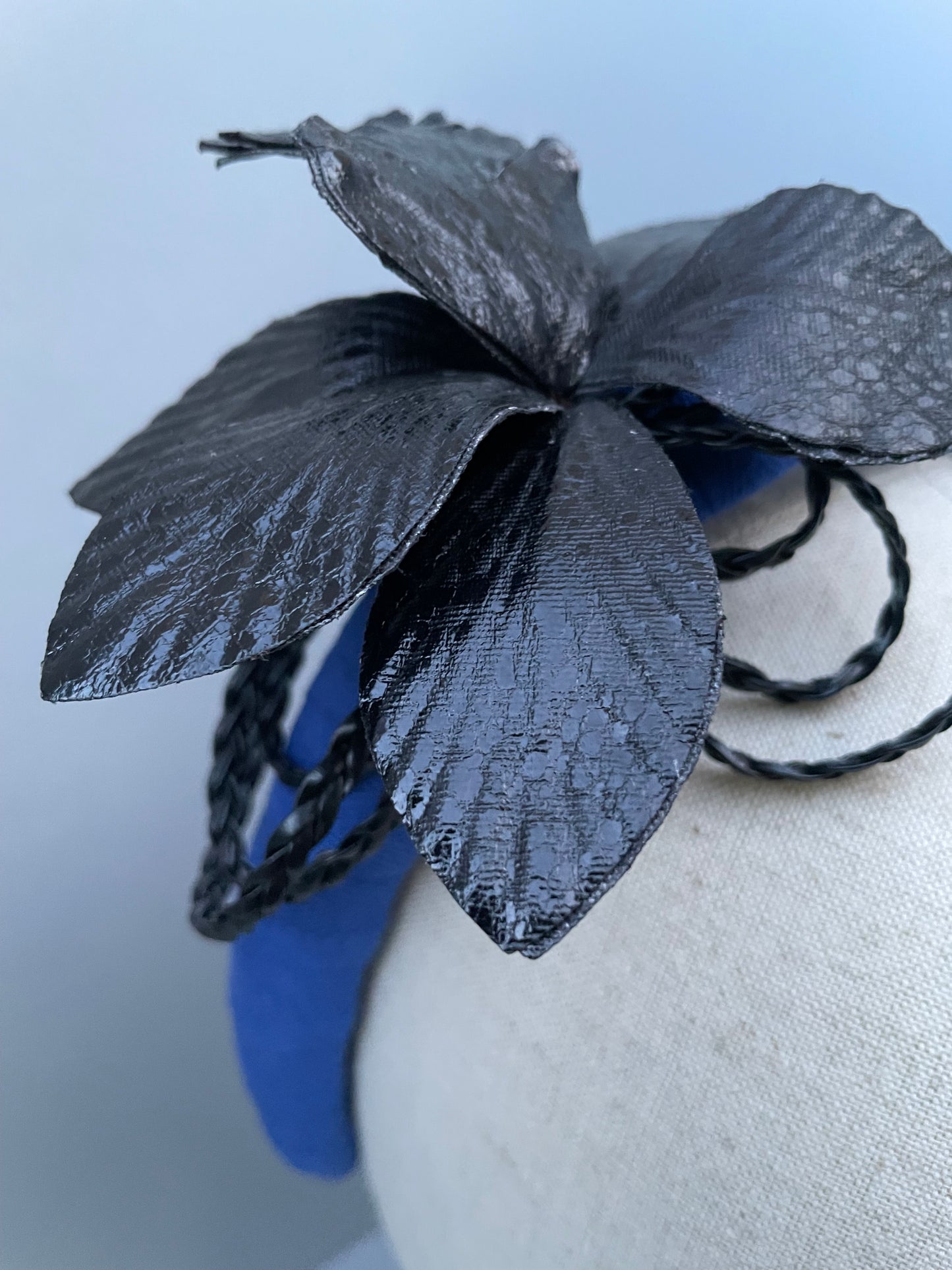 Cobalt blue padded headband with black leatherette orchid